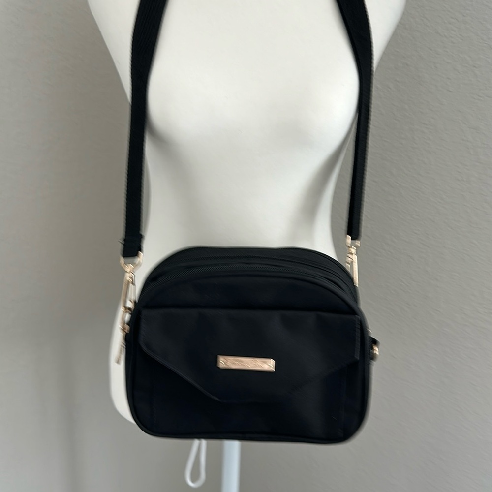 Handbag with a surprise compartment